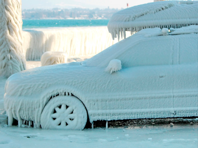 A frozen car covered in sheets of ice