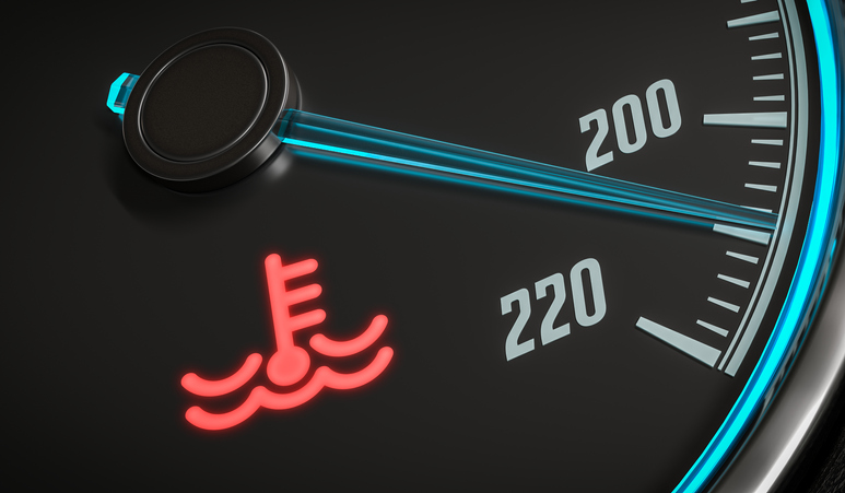A warning light on a car dashboard shows the engine is overheating.