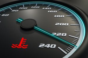 An engine warning light on the dashboard indicates the engine is overheating.