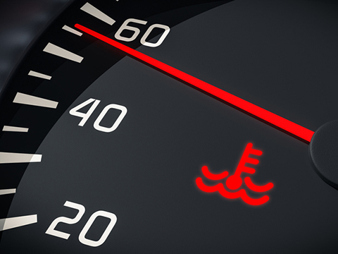 A dashboard indicator shows that a car's engine is starting to overheat.