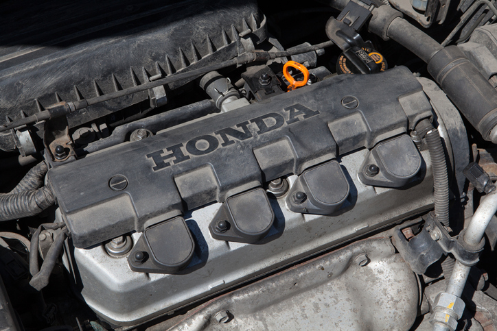 Close-up of a 1.4l Honda petrol engine under the hood of a 2004 Honda Civic.